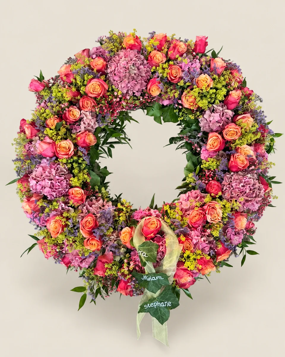 B10: Kranz in Rosa, Orange und Violett.